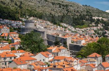 Homes and houses crowded on the hillside outside city walls in Dubrovnik in Croatia