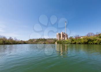 Industrial power station on the banks of the Monongahela river on a calm spring day in Morgantown, West Virginia