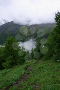 Mountain landscape. Highlands, the mountain peaks, gorges and valleys. The stones on the slopes.