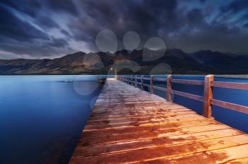 Wooden pier, Wakatipu Lake at dawn, Glenorchy, New Zealand 