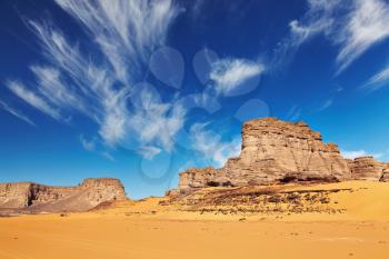 Desert landscape with rocks and blue sky, Tadrart, Algeria