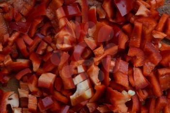 Pepper. Capsicum annuum. Slices of red pepper. Close-up. Splitting. On a cutting board. Cooking food. Delicious. Horizontal