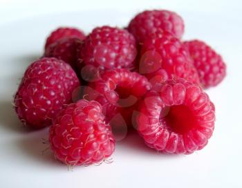 beautiful ripe raspberries on white background