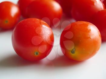 fresh cherry tomatoes on white background