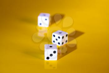 Three simple game cube on a bright yellow background