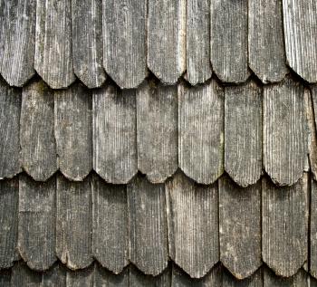 old roof overlapping from wooden plates close-up