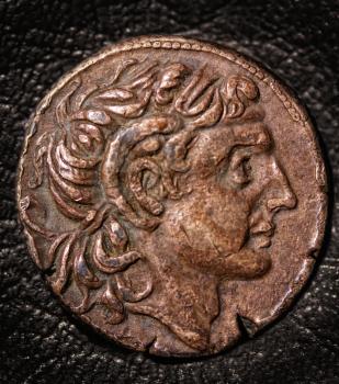 ancient greek coin tetradrachm on a dark background