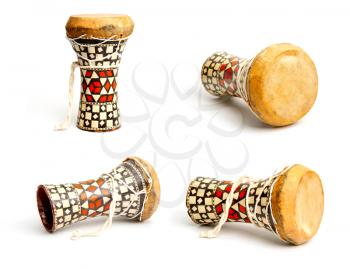 Handmade small african wooden drum in several angles on a white background