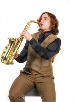 young saxophonist playing his bronze saxophone isolated on white background