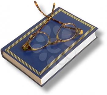 Royalty Free Photo of a Book With Reading Glasses on Top 