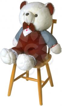 Royalty Free Photo of a Teddy Bear on a Chair