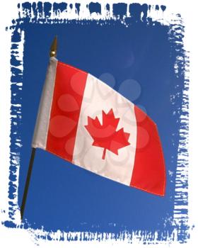 Royalty Free Photo of a Canadian Flag Flying in the Wind on a Sunny Day