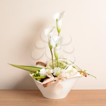 Interior decoration, decorative white calla in the white flowerpot.