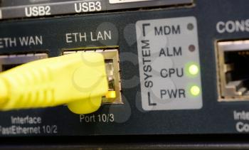 Yellow patch cord plugged to the ethernet port.