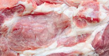 Texture of fresh raw pork meat with fat marbling.