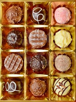 Top View of Belgian Chocolate Pralines in the Box. Sweet Pralines Close Up Background.