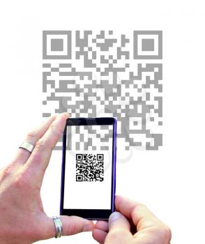 View over the mobile phone screen during scanning QR code isolated on white background. Hands holding mobile phone and scanning QR code.