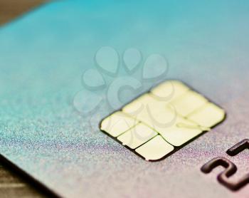 Close-up of electronic EMV chip in credit card.