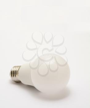 Close up of standard led light bulb on a white background.