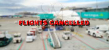 Plane at gate marked with cancelled sign waiting for passengers boarding. According to currently cancelled flights due to world pandemic of coronavirus.