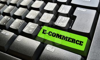 Black keyboard with one green key labeled by e-commerce sign.