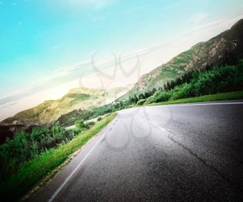 Road in mountains. Highway day summer background