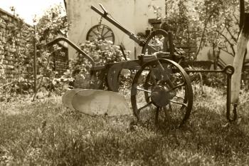 Old Vintage Rustic Agriculture Plow in Backyard