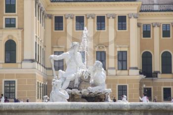 Vienna, Austria - July 06 2018: Schonbrunn Palace or Schloss Schönbrunn. Fountain In The Yard. Imperial summer residence in Vienna, Austria 