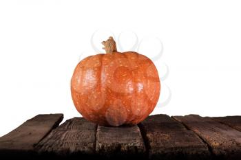Pumpkin For Halloween with Copy Space Resting On Wooden Table Isolated On White Background