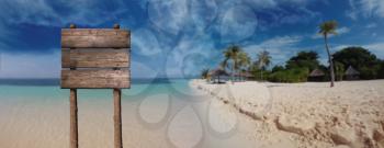 Summer Wooden Board Blank Sign for Copy Space At Beautiful Sandy Beach Tropical Island
