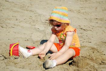Beauty little girl playing on beach