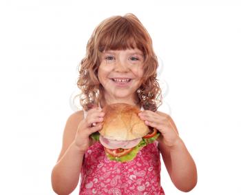 happy little girl holding big sandwich
