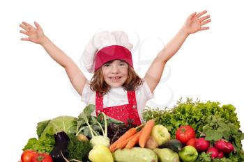 happy little girl cook with vegetables