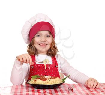 happy little girl cook eat spaghetti