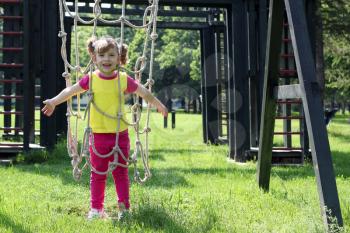 happy little girl on park playground