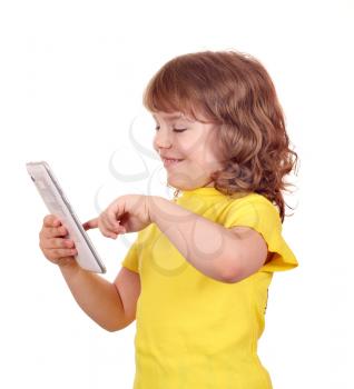 happy little girl play with tablet pc on white 