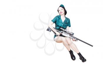 Portrait of Beautiful Brunette with black hair. Pin up Female Dressed in military clothing Uniform and Garrison cap with sniper rifle. Army Pin-up Girl Concept, lot of copyspace
