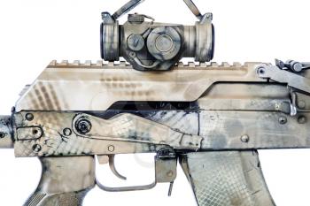 Close-up shot of Kalashnikov rifle receiver cover with collimator, automatic weapons isolated on white background. Gun is painted desert camouflage
