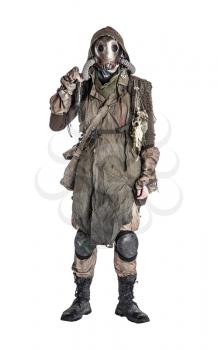 Terrifying post apocalyptic human creature, person survived in poisoned by pollution, post nuclear catastrophe world wearing tatters and full-face gas mask isolated on white background studio shoot