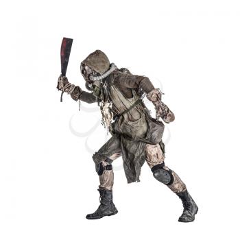 Aggressive and evil humanoid monster or creature of post apocalyptic, poisoned by dangerous pollution world wearing tattered rags and gas mask, brandishing bloodstained machete studio shoot on white