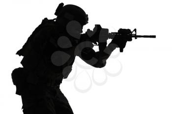 United states Marine Corps special operations command Marsoc raider with weapon aiming a gun. Silhouette of Marine Special Operator white background