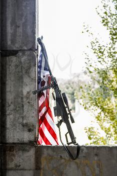 Large caliber sniper rifle with US banner