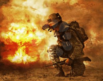 US soldier in the desert during the military operation turning to nuclear explosion mushroom cloud covering his eyes. He is doomed