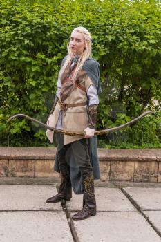 Lviv, Ukraine - May 23,2015: Woman, dressed in the style of the Middle Ages performs on stage at the festival cosplay Anicon in Lviv May 23.2015