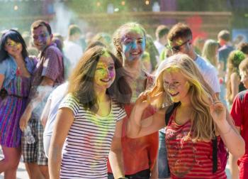Lviv, Ukraine - August 30, 2015: Girls have fun during the festival of color in a city park in Lviv.