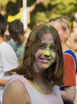 Lviv, Ukraine - August 30, 2015: Girl have fun during the festival of color in a city park in Lviv.