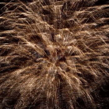 Abstract yellow fireworks on the black sky background. Holiday celebration.