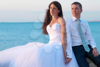 Beautiful wedding couple- bride and groom at the beach. Just married