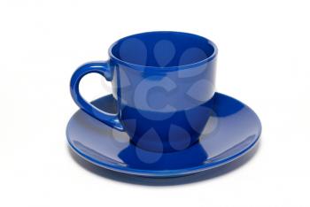 Blue ceramic cup and saucer isolated on white.