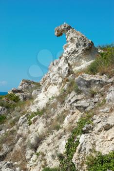 A coastline with many big rocks.